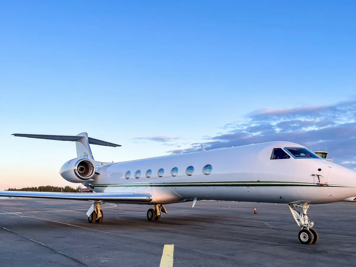 Large-cabin Gulfstream on the ramp under a blue sky