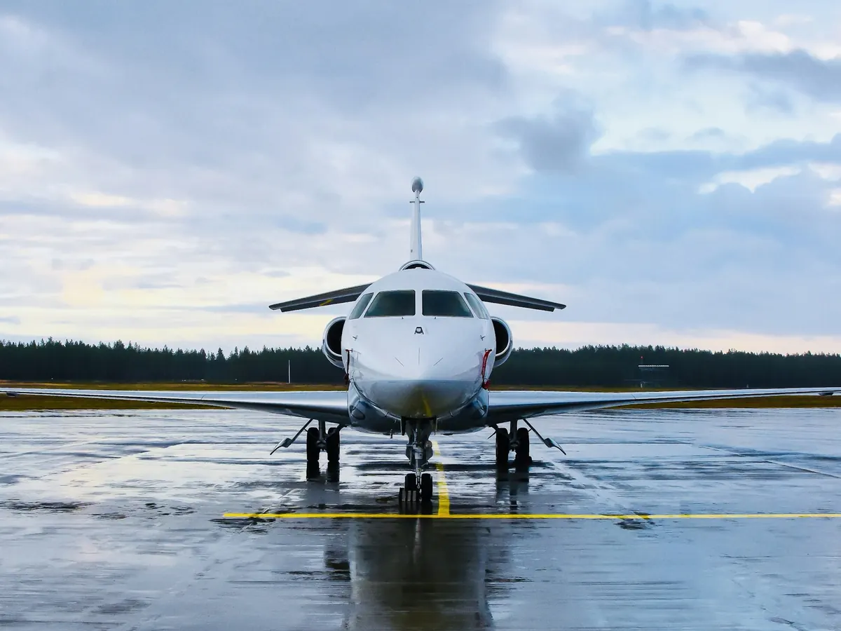 Business jet on a wet ramp, nose on