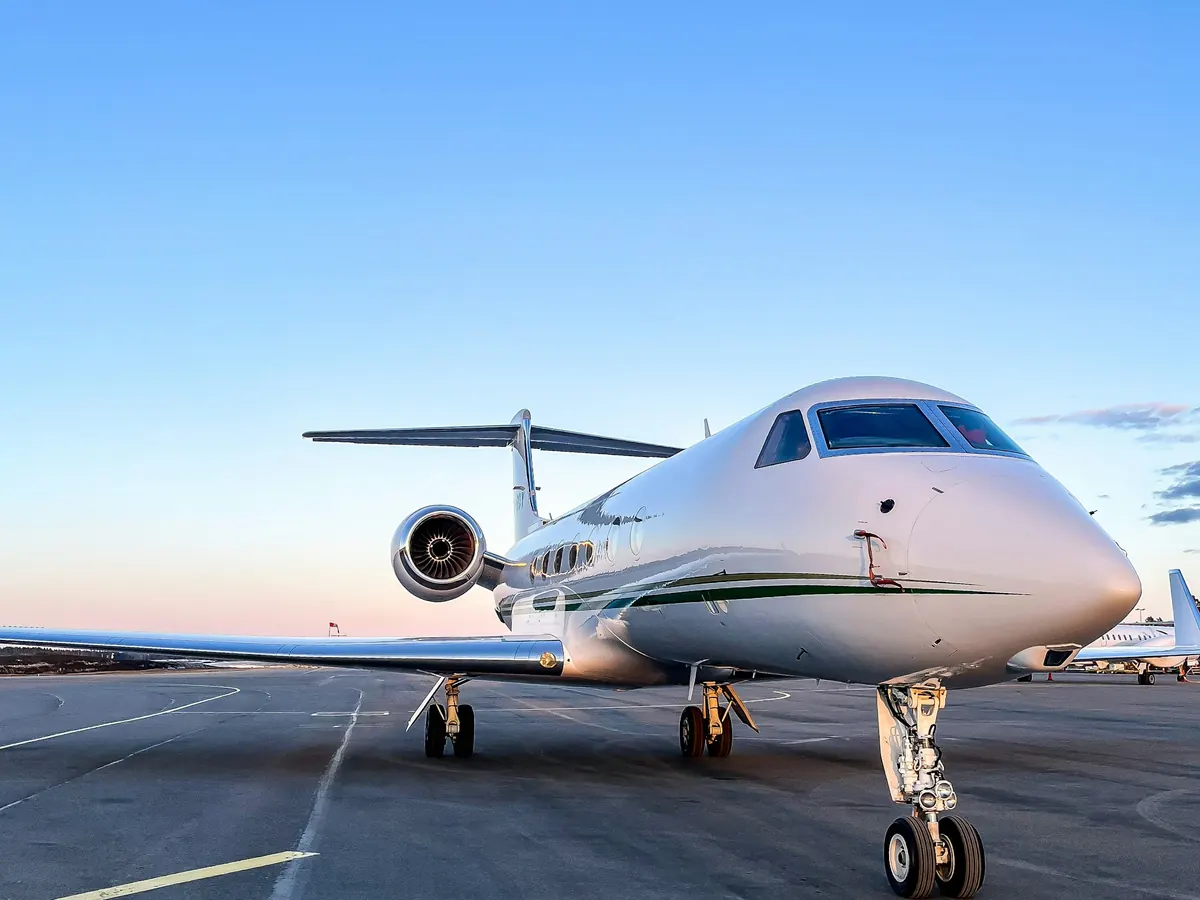 Business jet parked on a sunny apron