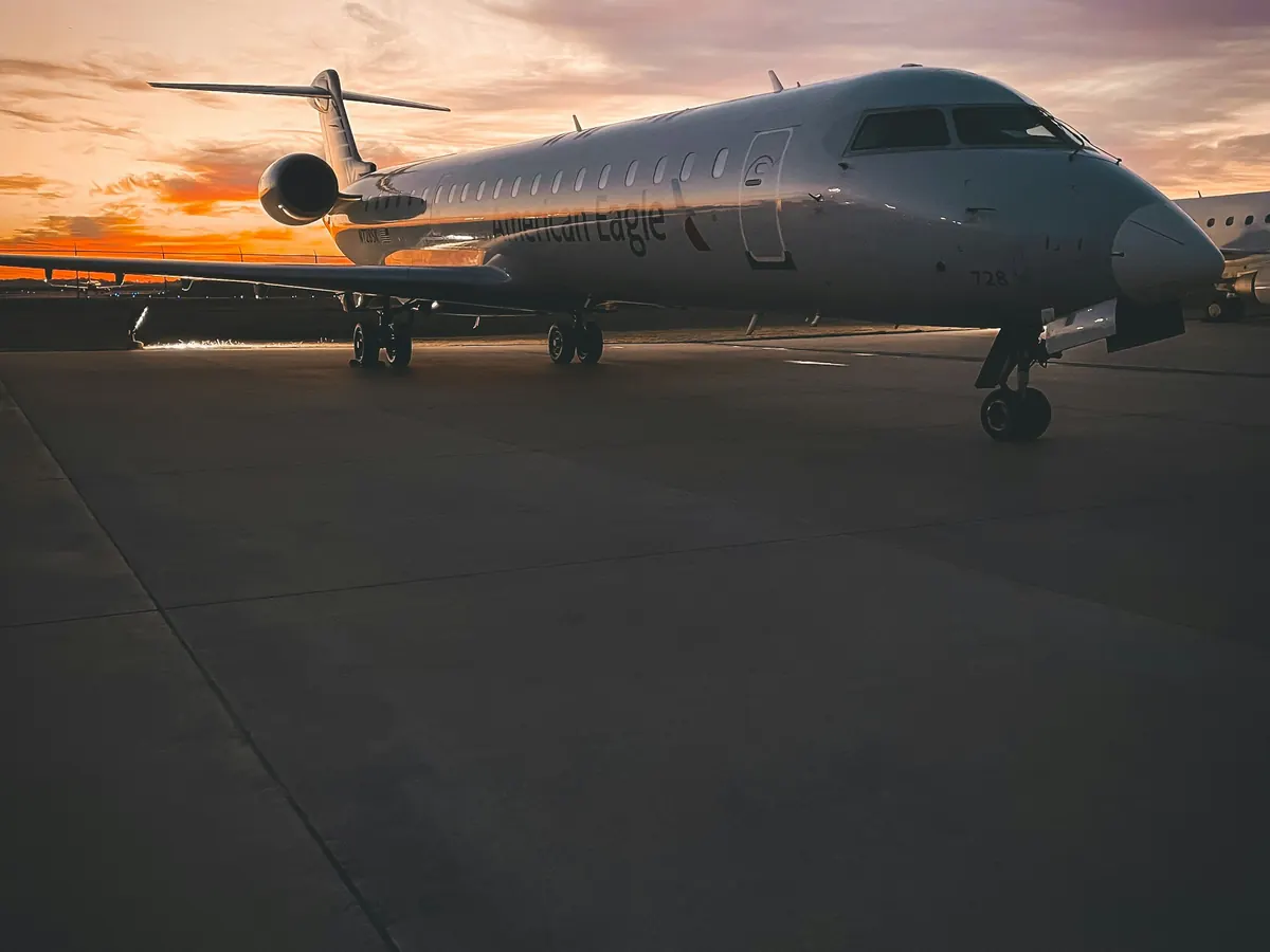 Small business jet facing the camera on the apron at dusk