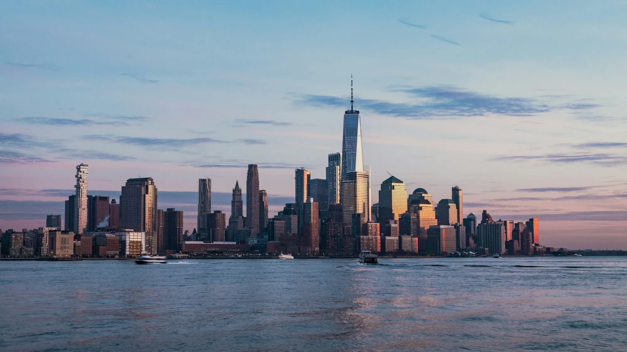 Manhattan skyline across the Hudson River at dusk